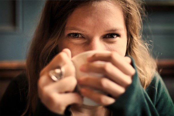 A Woman drinking a cup of tea