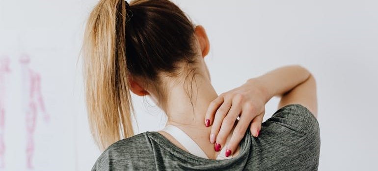 a woman feeling sore after a workout